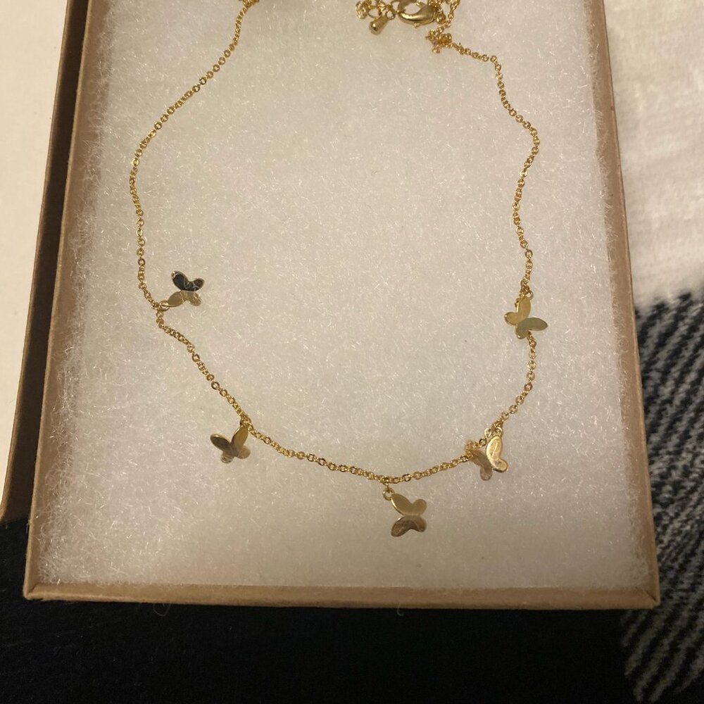 Butterfly choker necklace.  Gold plated costume jewelry.  Brand new w tag.  $10
